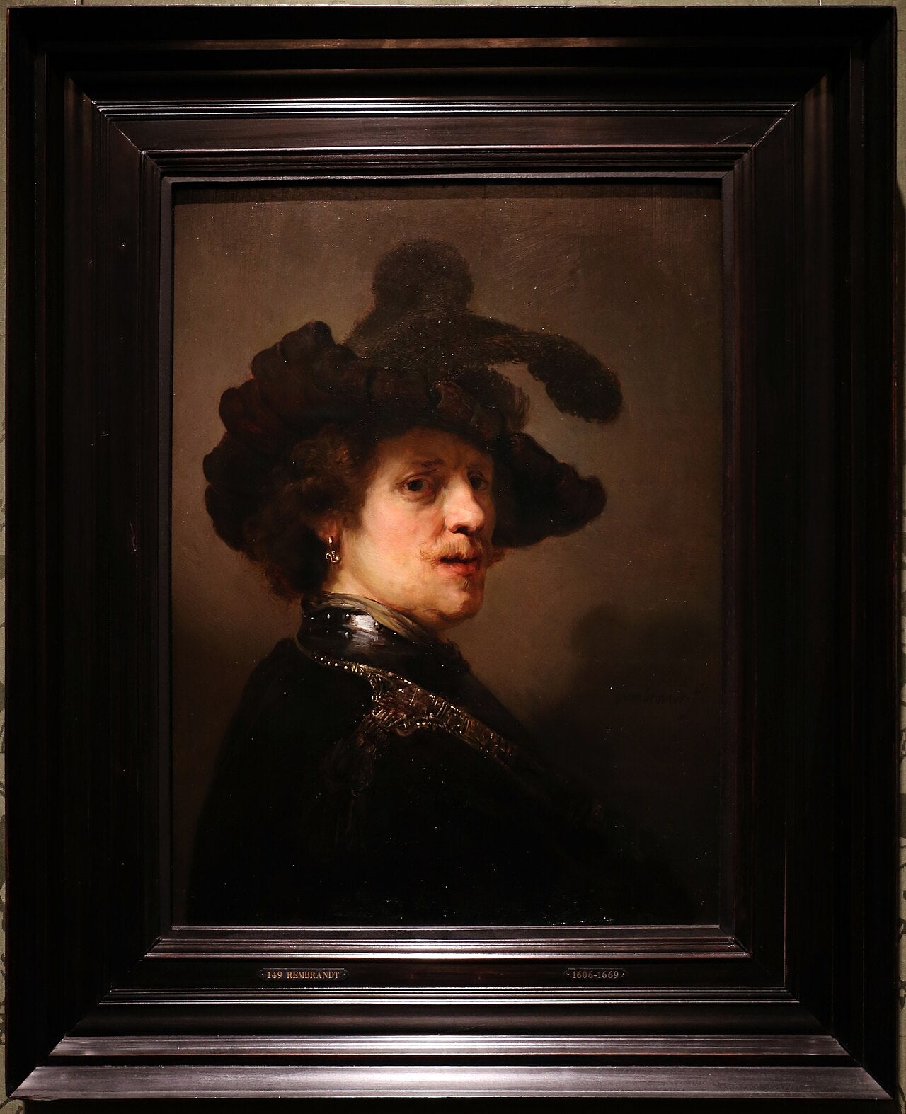 Muž s péřovou čepicí - Rembrandt