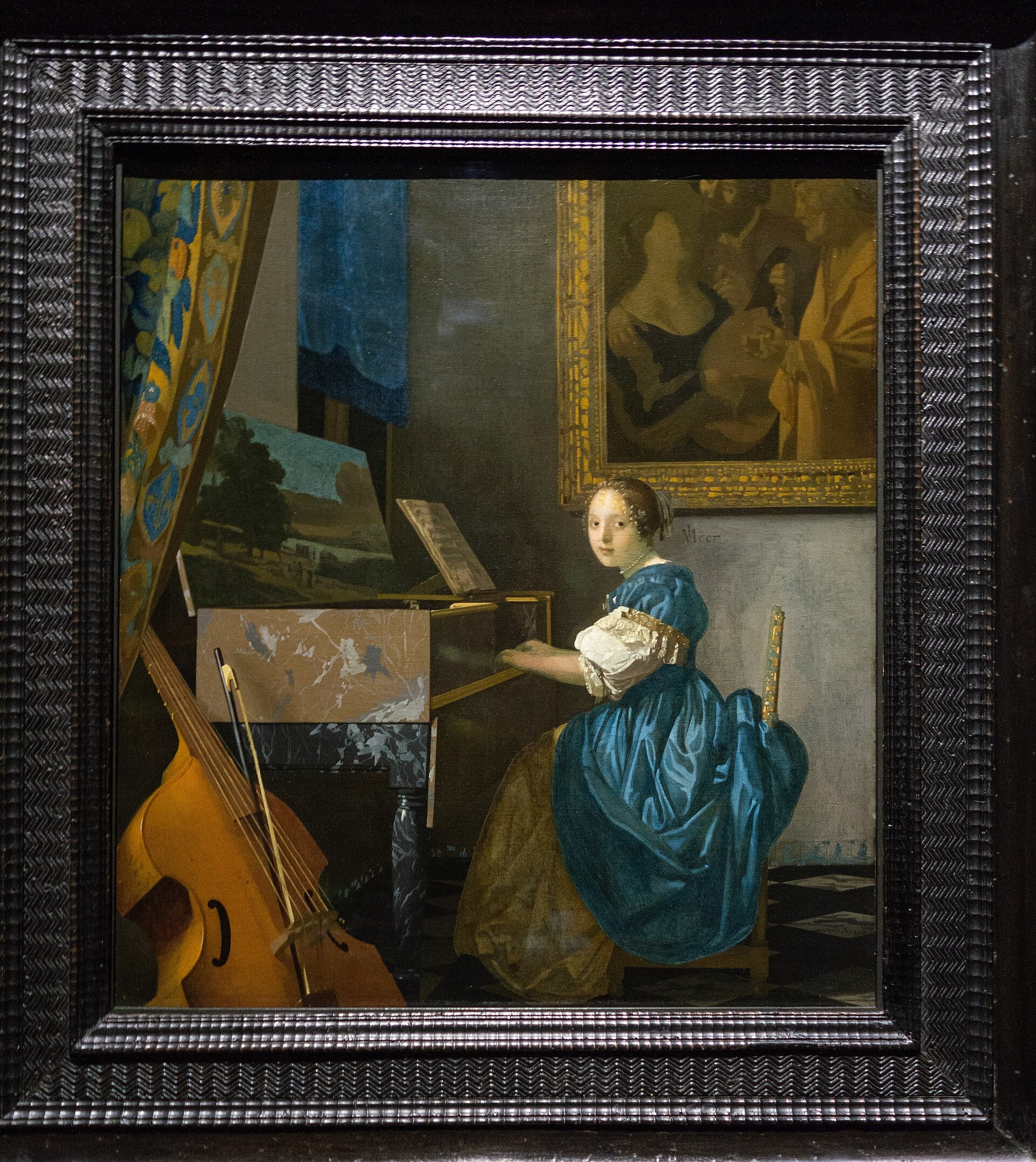 Mladá žena hrající na virginal - Johannes Vermeer